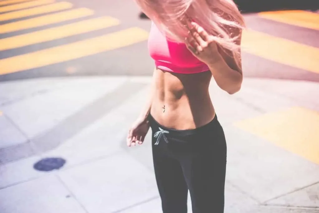 Woman with toned stomach after LA-EMS Body Sculpting Treatment Hitchin